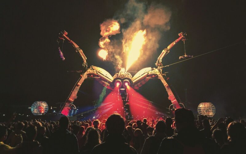 Festival crowd in front of a lit stage