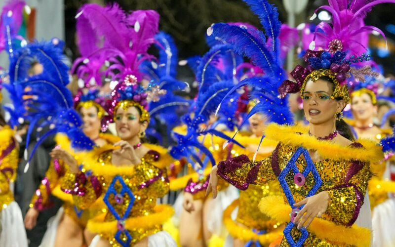 Carnival dancers in feathered costumes